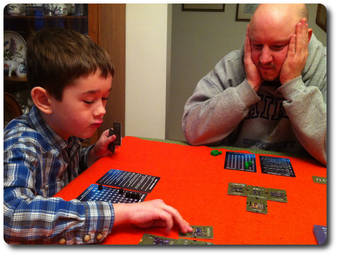 Still early in the game as I carefully observe my little geek's grasp of the game rules