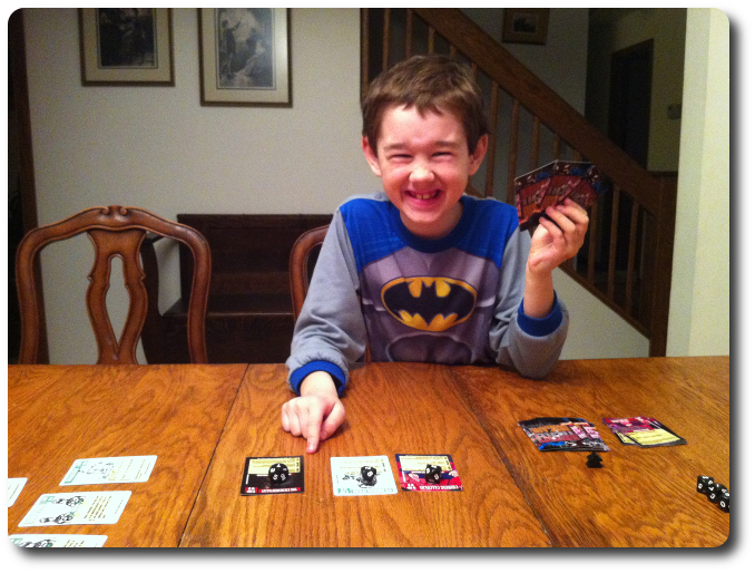 My little geek smiles with joy as he brings out his favorite villain, the Extrementalist!